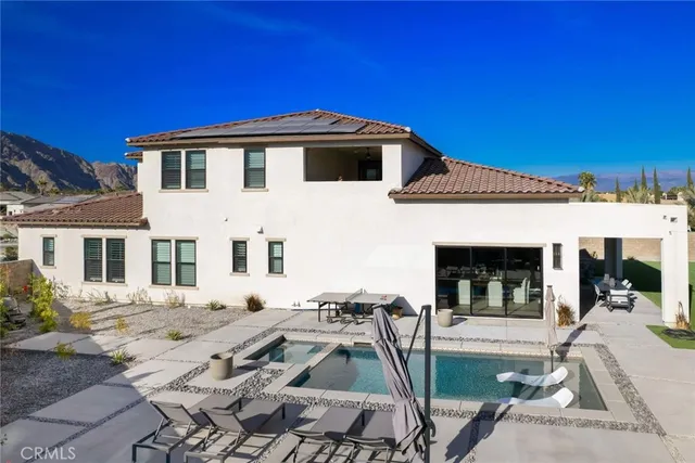 a front view of a house with a patio
