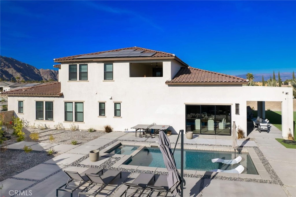 80467 Old Ranch Trail South La Quinta, CA 92253 - Photo 4 of 55 a front view of a house with a patio