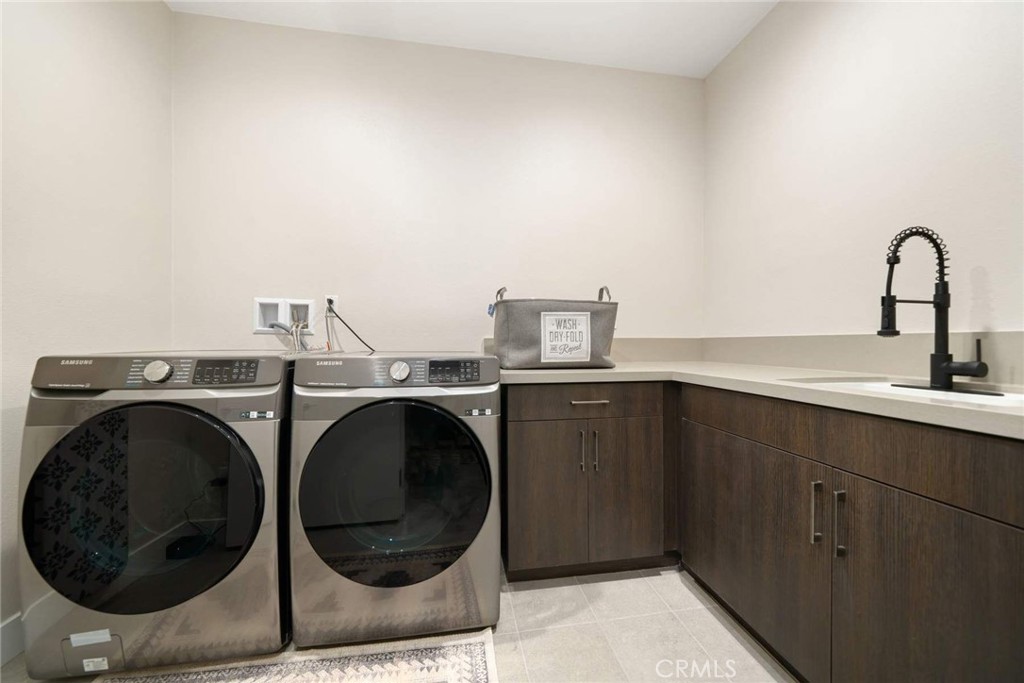 80467 Old Ranch Trail South La Quinta, CA 92253 - Photo 47 of 55 a utility room with sink dryer and washer