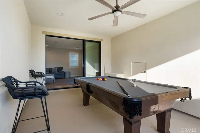 a bedroom with a bed and a flat tv screen on dresser