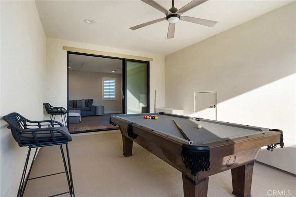 80467 Old Ranch Trail South La Quinta, CA 92253 - Photo 48 of 55 a room with furniture and wooden floor