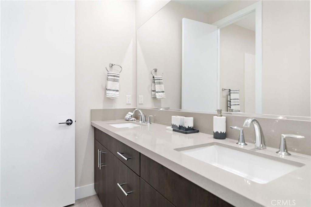 80467 Old Ranch Trail South La Quinta, CA 92253 - Photo 54 of 55 a bathroom with a sink and a mirror