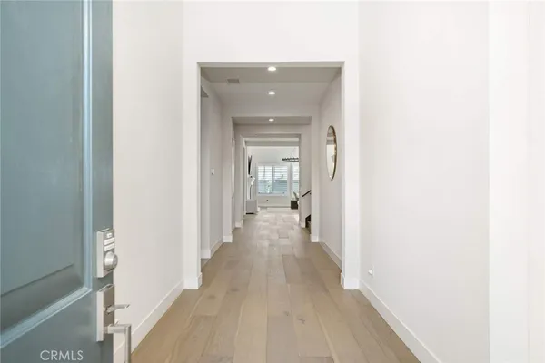 a kitchen with stainless steel appliances a stove a sink a microwave and wooden cabinets