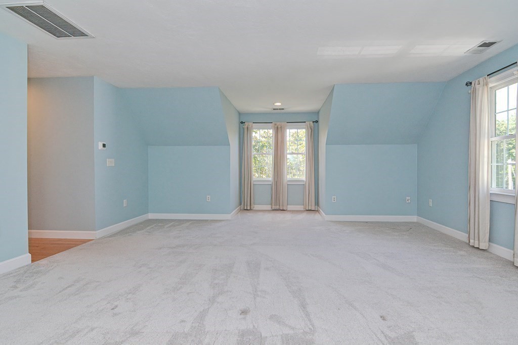 513 Taylor Road Stow, MA 01775 - Photo 23 of 40 an empty room with windows