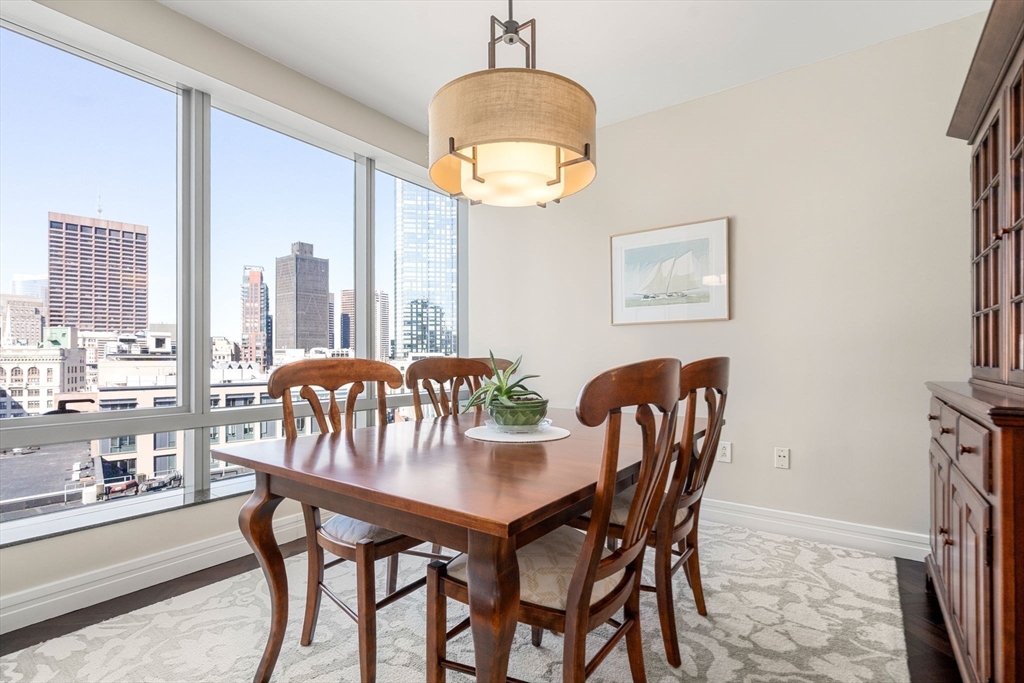 1 Avery Street, Unit 16G Boston, MA 02111 - Photo 8 of 15 a dining room with furniture and window