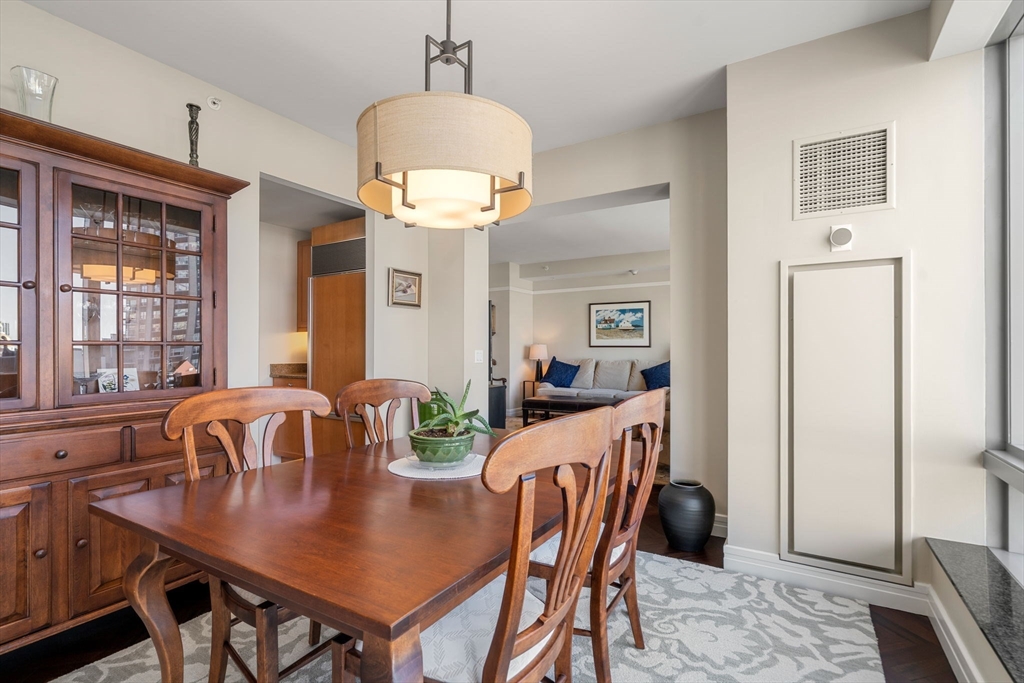 1 Avery Street, Unit 16G Boston, MA 02111 - Photo 9 of 15 a view of a dining room with furniture