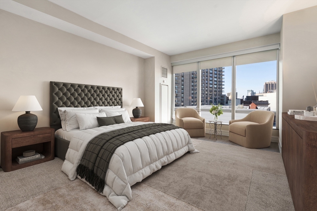 1 Avery Street, Unit 16G Boston, MA 02111 - Photo 10 of 15 a spacious bedroom with a bed and glass windows