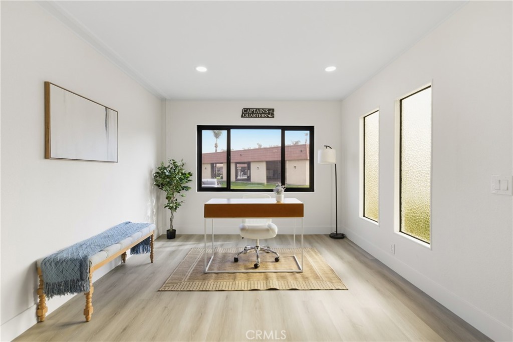 300 North Rampart Street, Unit 152 Orange, CA 92868 - Photo 13 of 29 a living room with furniture and a large window