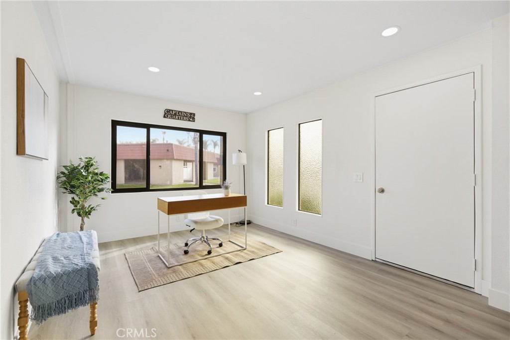 300 North Rampart Street, Unit 152 Orange, CA 92868 - Photo 14 of 29 a living room with furniture and large windows