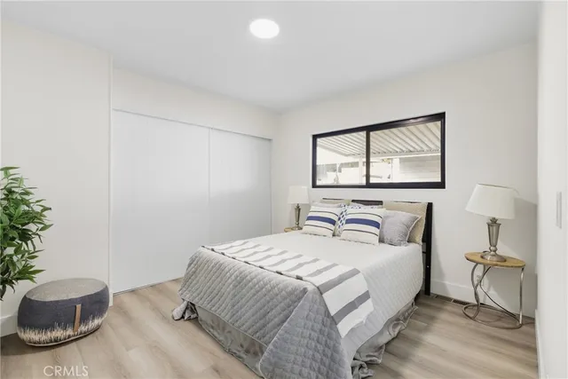 a bedroom with a bed and a chair