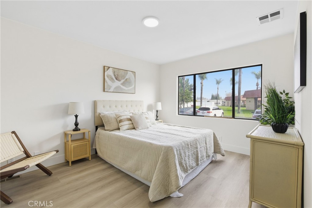 300 North Rampart Street, Unit 152 Orange, CA 92868 - Photo 20 of 29 a bedroom with a large bed and a window