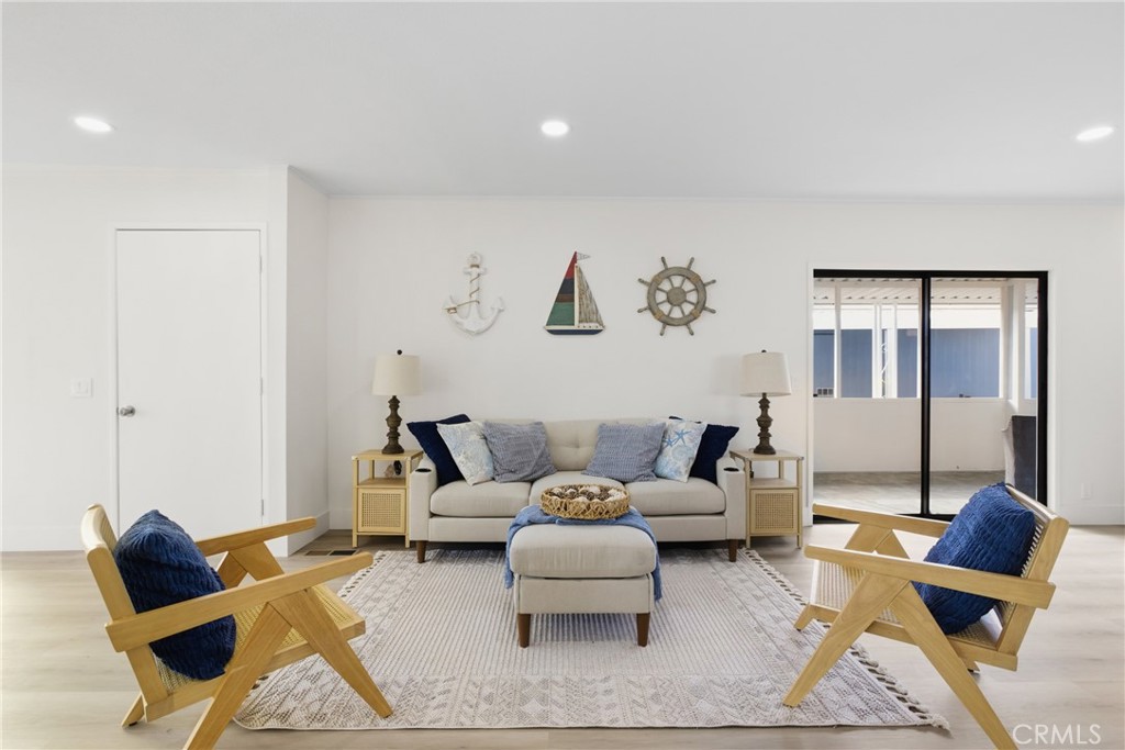 300 North Rampart Street, Unit 152 Orange, CA 92868 - Photo 2 of 29 a living room with furniture and a large window