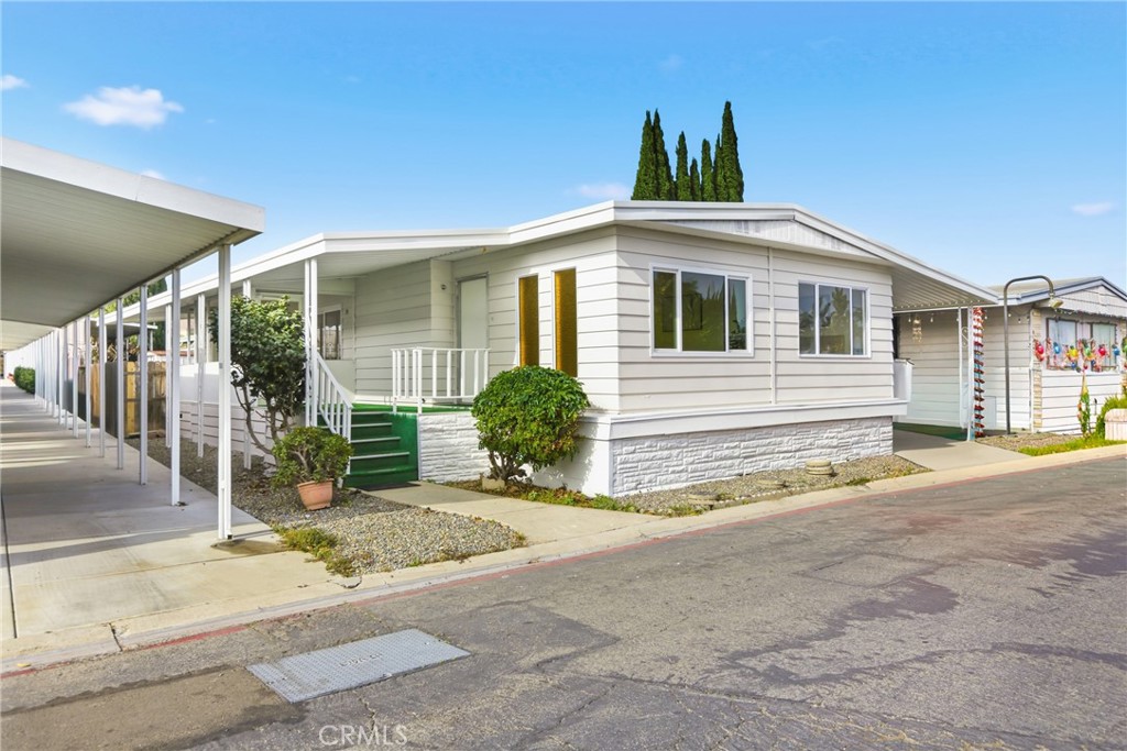 300 North Rampart Street, Unit 152 Orange, CA 92868 - Photo 25 of 29 a view of a house with a patio