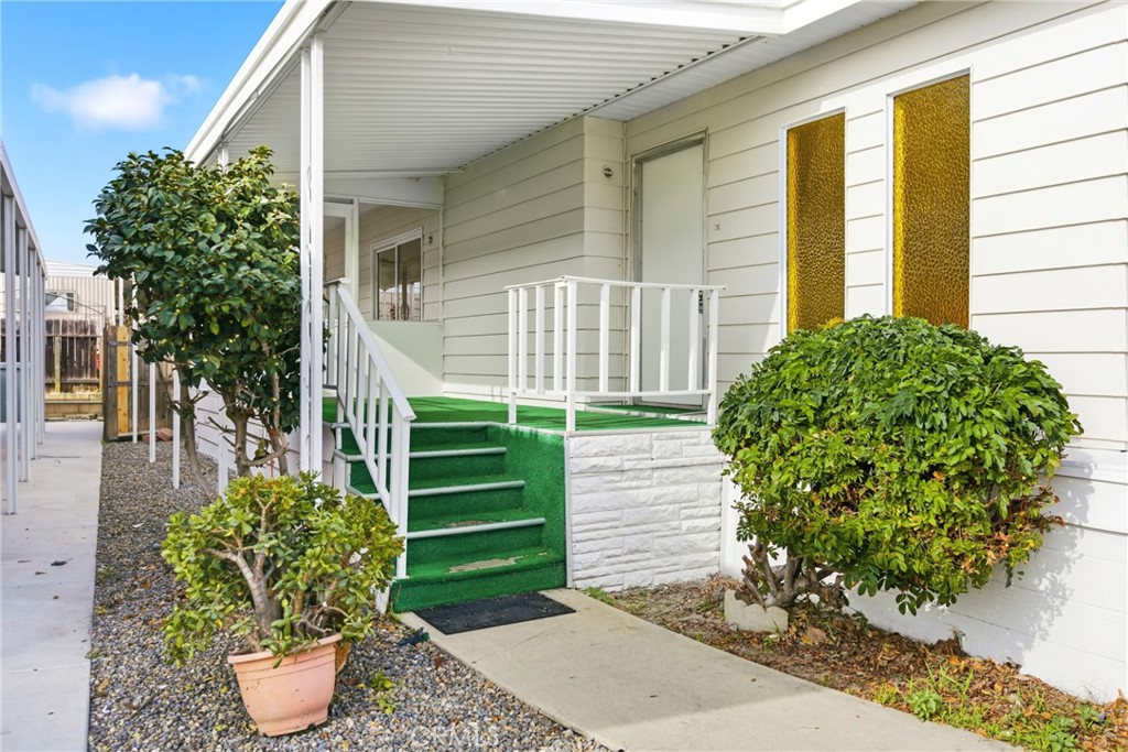 300 North Rampart Street, Unit 152 Orange, CA 92868 - Photo 26 of 29 a front view of a house with garden