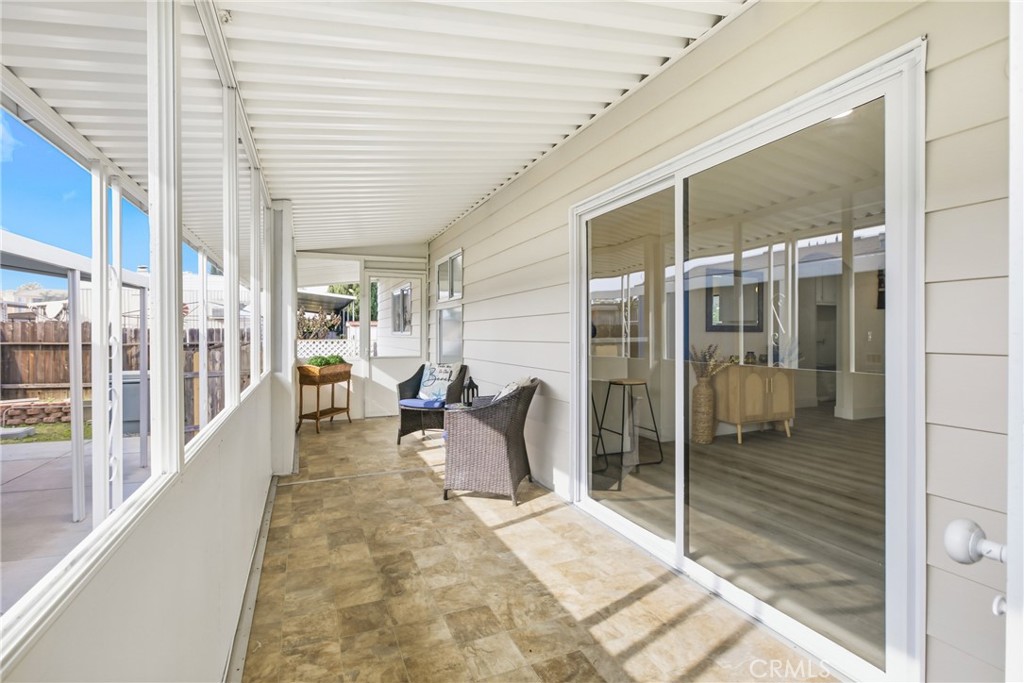300 North Rampart Street, Unit 152 Orange, CA 92868 - Photo 27 of 29 a porch with a table and chairs