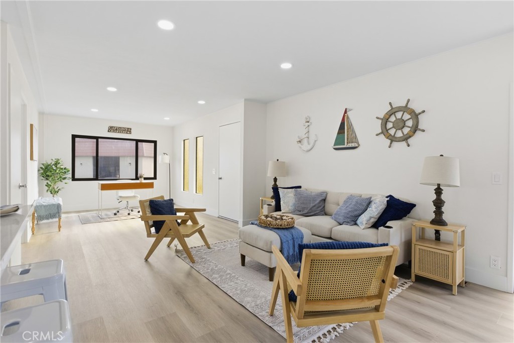 300 North Rampart Street, Unit 152 Orange, CA 92868 - Photo 3 of 29 a living room with furniture and a large window