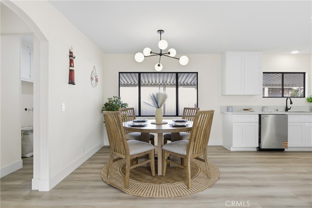 300 North Rampart Street, Unit 152 Orange, CA 92868 - Photo 8 of 29 a view of a dining room with furniture window and wooden floor