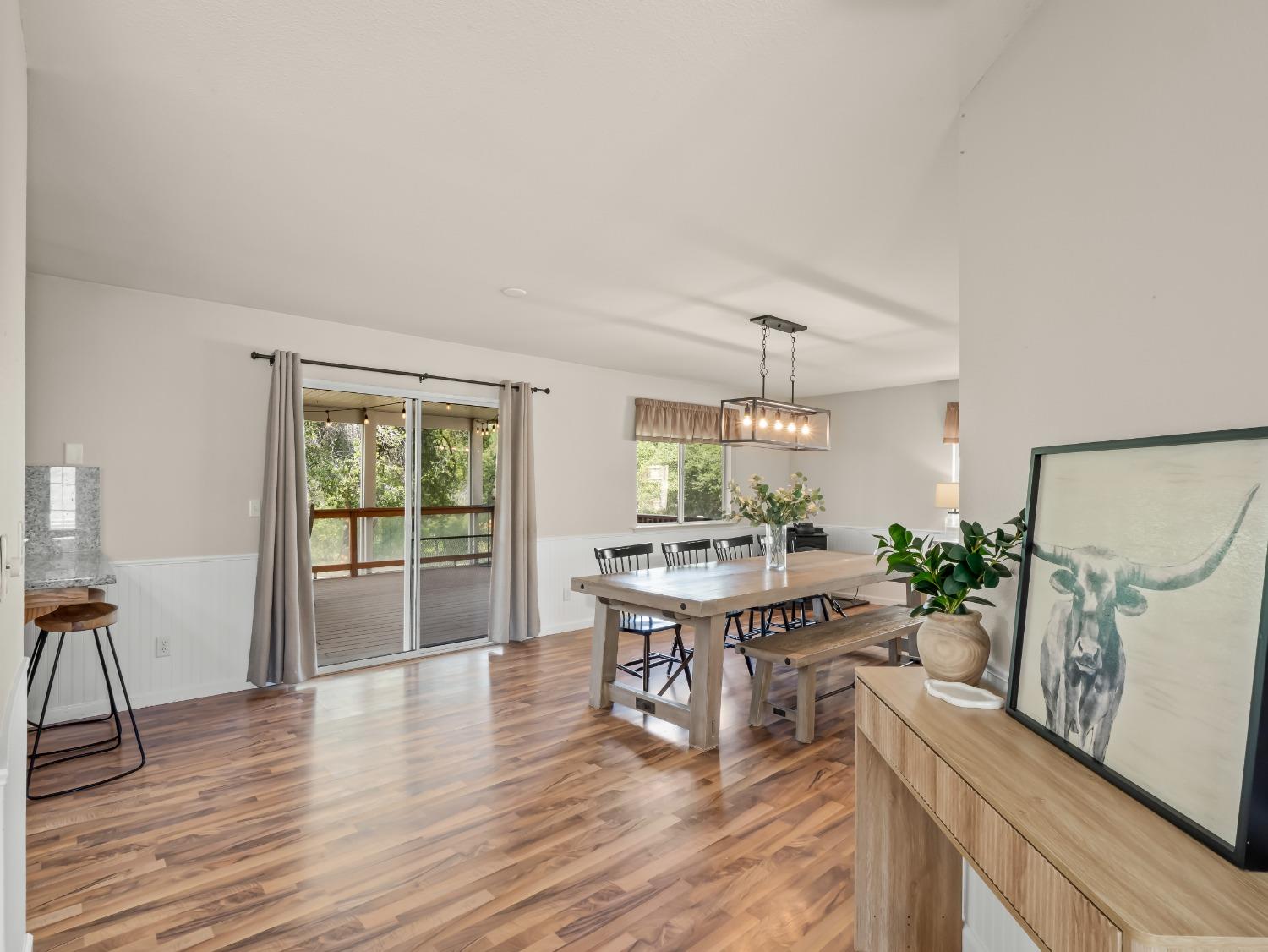 31173 Moccassin Way Coarsegold, CA 93614 - Photo 12 of 48 a view of a dining room with furniture window and wooden floor
