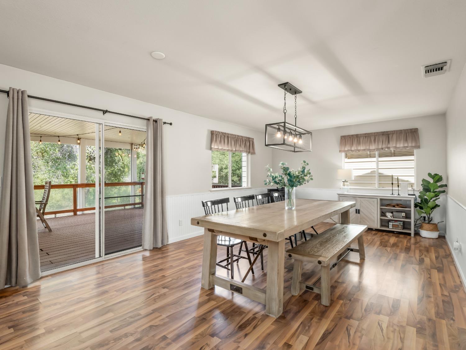 31173 Moccassin Way Coarsegold, CA 93614 - Photo 13 of 48 a view of a dining room with furniture window and wooden floor