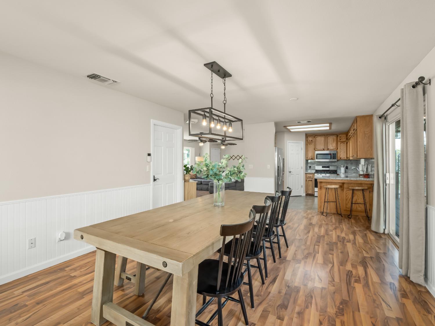 31173 Moccassin Way Coarsegold, CA 93614 - Photo 14 of 48 a view of a dining room with furniture window and wooden floor