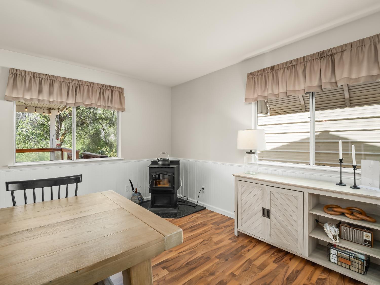 31173 Moccassin Way Coarsegold, CA 93614 - Photo 15 of 48 a kitchen with a stove a sink a window and dining table