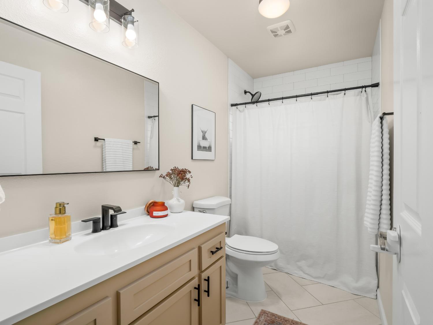 31173 Moccassin Way Coarsegold, CA 93614 - Photo 22 of 48 a bathroom with a sink a toilet and shower