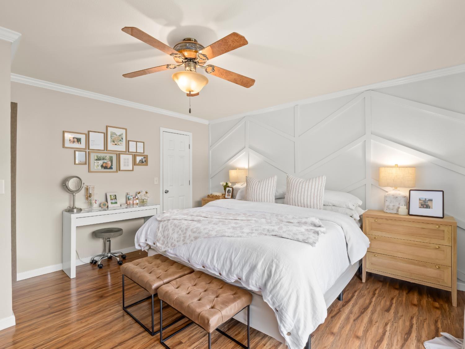 31173 Moccassin Way Coarsegold, CA 93614 - Photo 29 of 48 a bedroom with a bed and a chandelier
