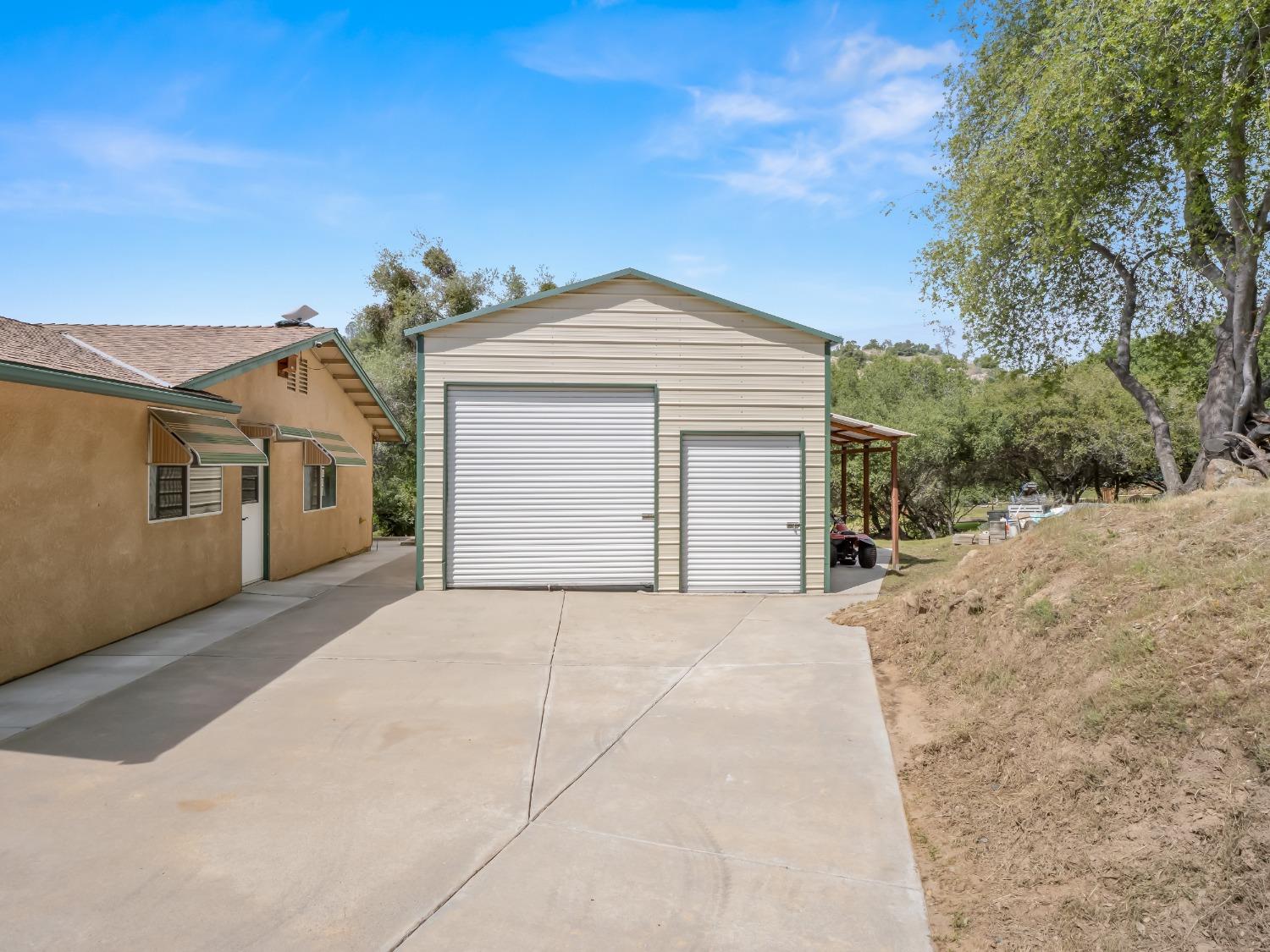 31173 Moccassin Way Coarsegold, CA 93614 - Photo 35 of 48 a front view of a house with a yard