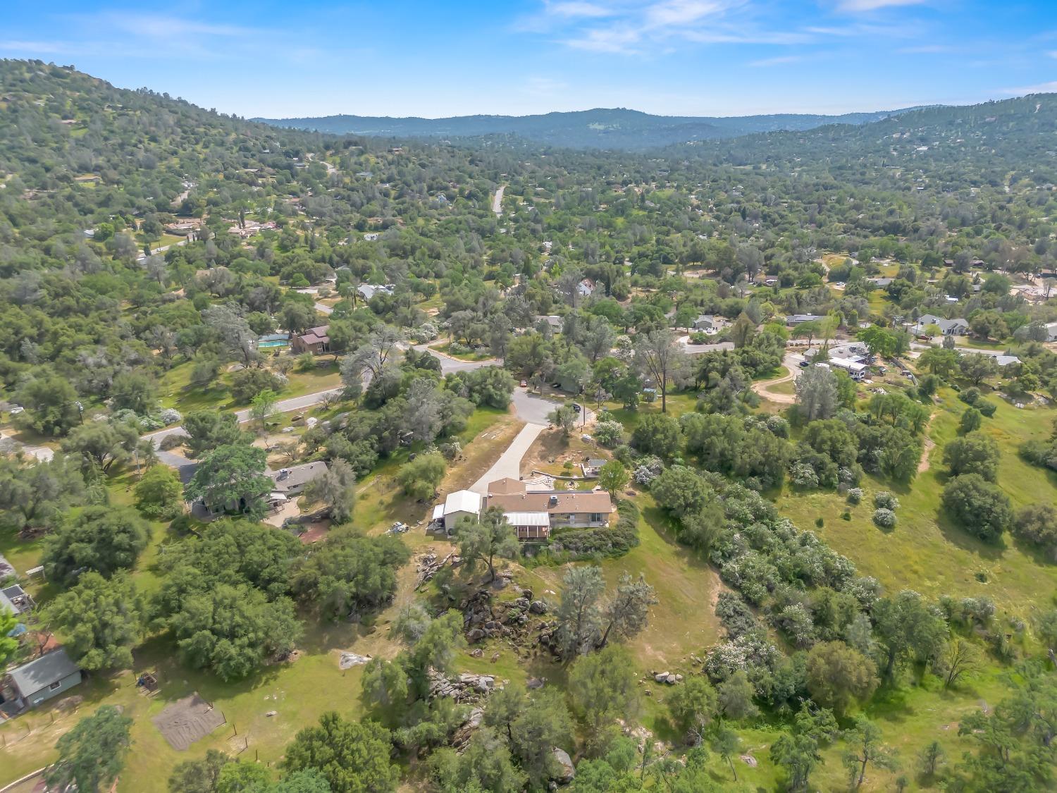 31173 Moccassin Way Coarsegold, CA 93614 - Photo 38 of 48 a view of a city with mountains in the background