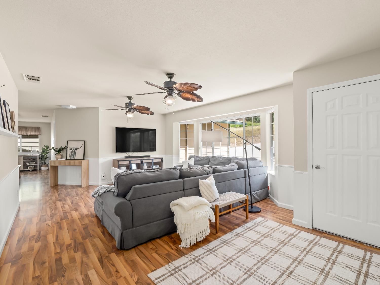 31173 Moccassin Way Coarsegold, CA 93614 - Photo 7 of 48 a living room with furniture and a flat screen tv