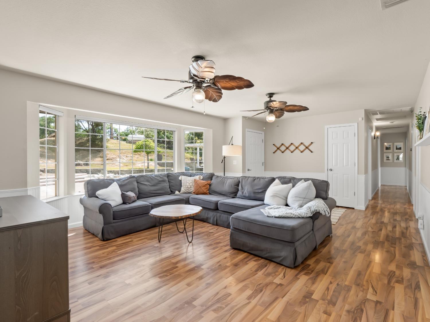 31173 Moccassin Way Coarsegold, CA 93614 - Photo 9 of 48 a living room with furniture and a large window