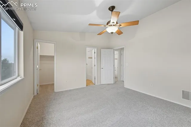 a picture of a bench in front of a wall