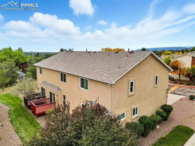 a view of a hallway with wooden floor and entryway