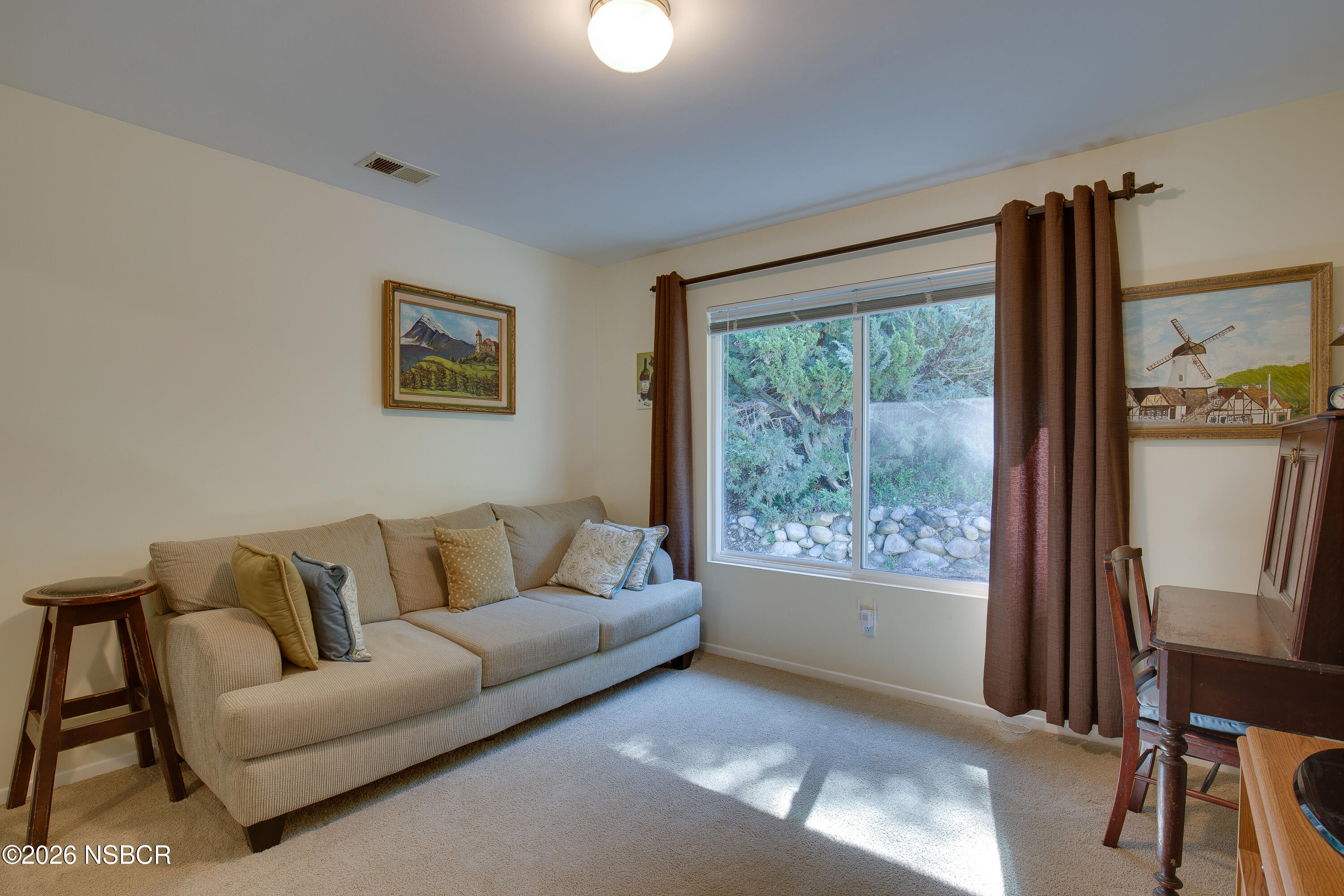 850 Fredensborg Canyon Road Solvang, CA 93463 - Photo 12 of 26 a living room with furniture and a window