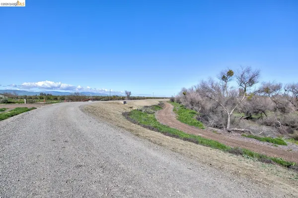 a view of a road with an ocean view