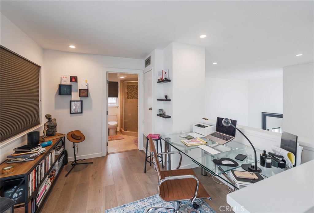 432 South Hamel Road, Unit 302 Los Angeles, CA 90048 - Photo 13 of 21 a view of a workspace with furniture and livingroom