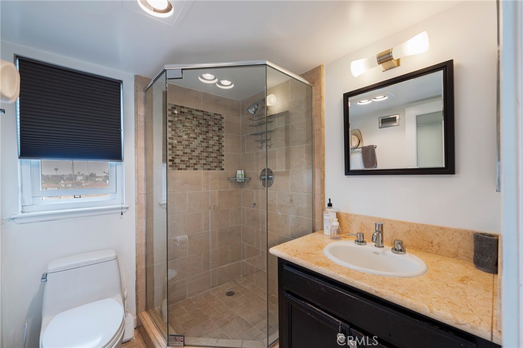 432 South Hamel Road, Unit 302 Los Angeles, CA 90048 - Photo 14 of 21 a bathroom with a sink a toilet and shower