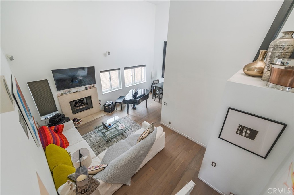 432 South Hamel Road, Unit 302 Los Angeles, CA 90048 - Photo 5 of 21 a living room with furniture and a flat screen tv