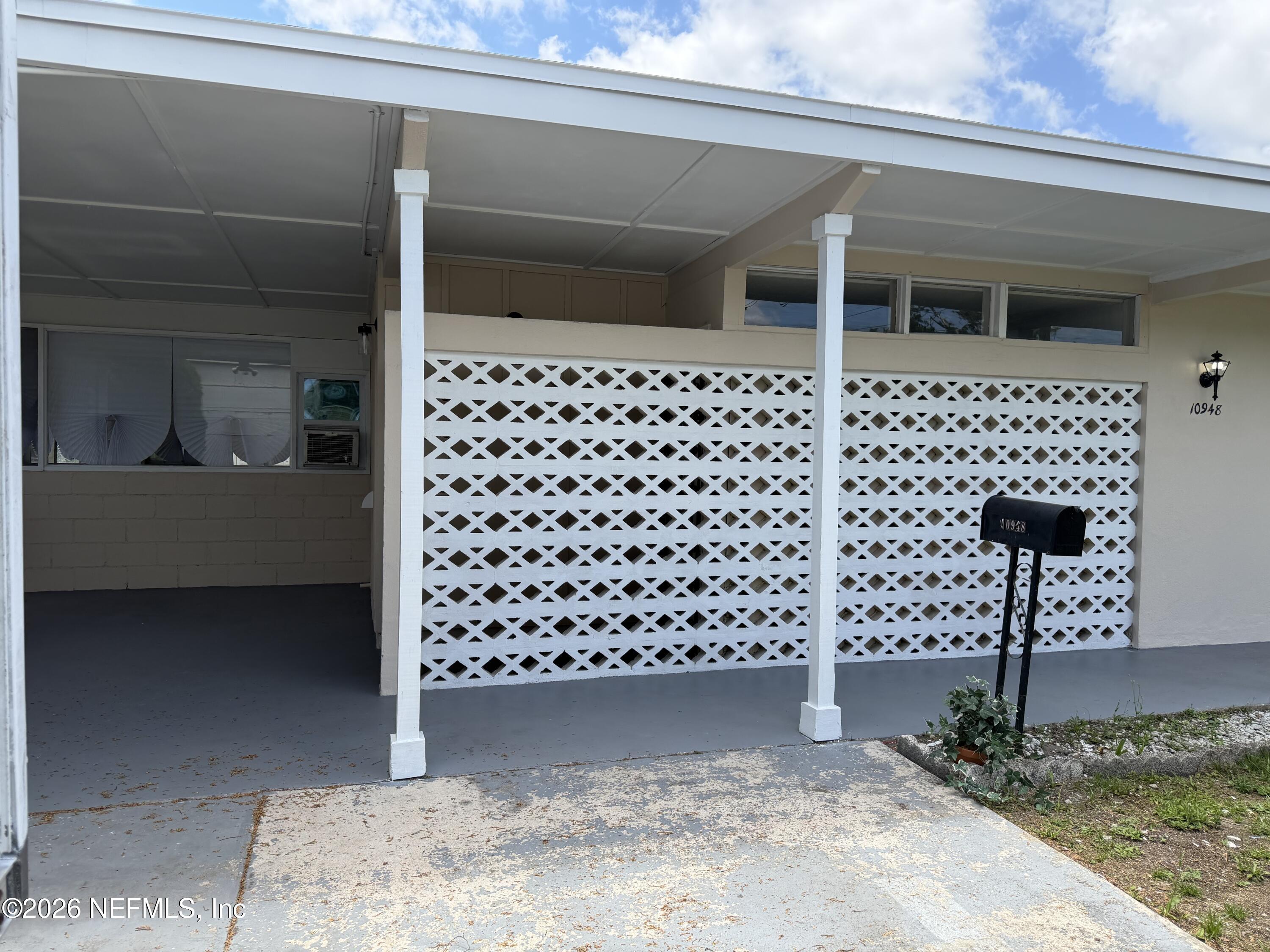 10948 Java Drive Jacksonville, FL 32246 - Photo 3 of 31 a view of a entryway door of the house