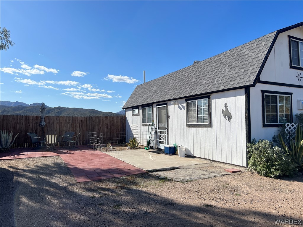 19167 Cholla Canyon Ranch Road Wikieup, AZ 85360 - Photo 19 of 97 a view of a house with a outdoor space