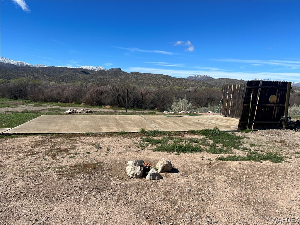 19167 Cholla Canyon Ranch Road Wikieup, AZ 85360 - Photo 54 of 97 a view of a yard with mountain view