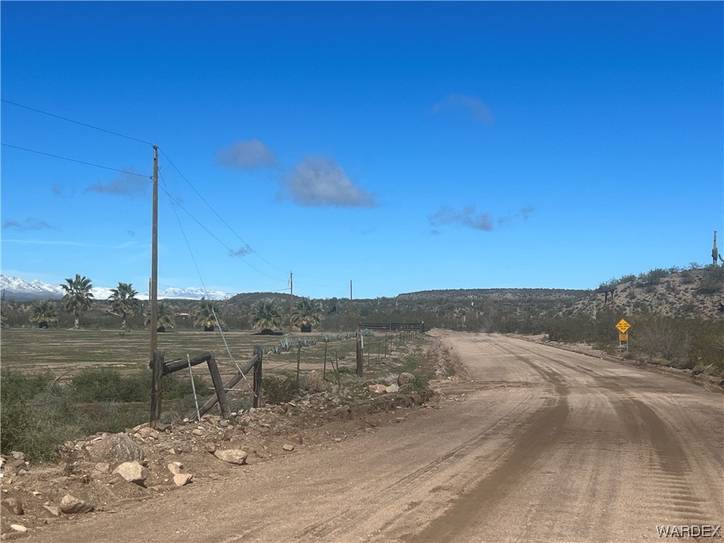 19167 Cholla Canyon Ranch Road Wikieup, AZ 85360 - Photo 6 of 97 a view of a road with an ocean view