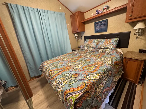 a bathroom with sink toilet and shower