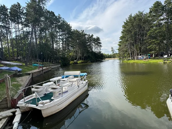 a view of a backyard with a sitting area