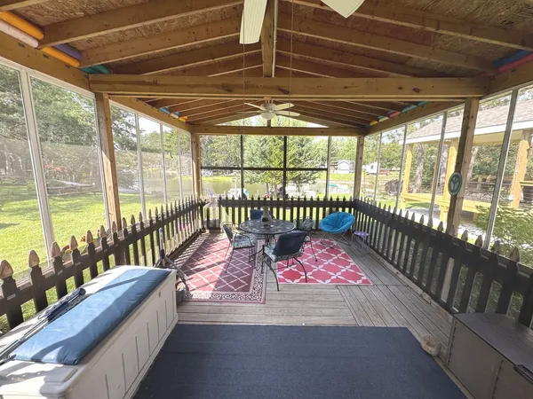 a swimming pool with some trees in the background