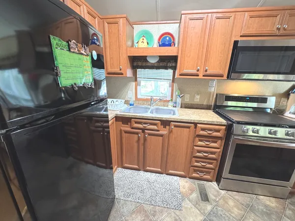 a bedroom with a bed dresser and a window