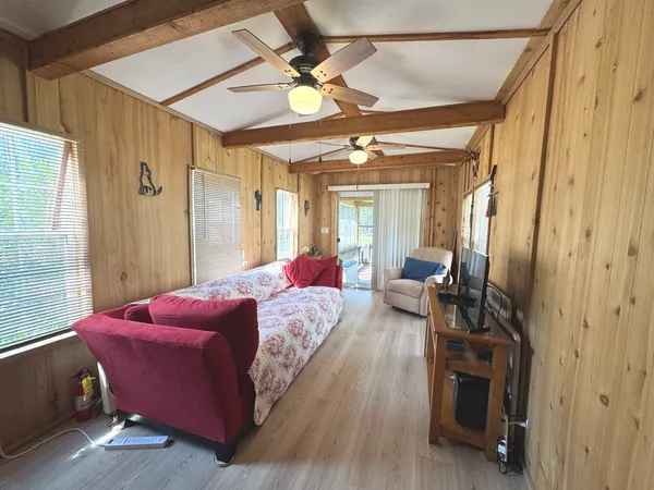 a bedroom with a bed and a mirror