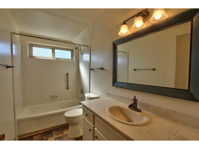 22675 Coleta Drive Salinas, CA 93908 - Photo 14 of 23 a bathroom with a sink a toilet and a mirror