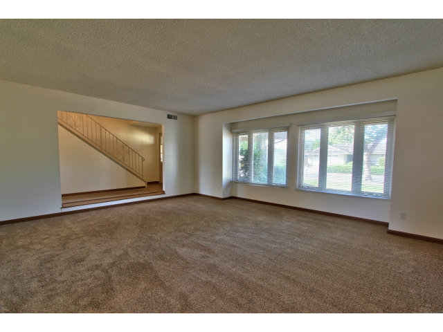 22675 Coleta Drive Salinas, CA 93908 - Photo 16 of 23 a view of an empty room with wooden floor and windows