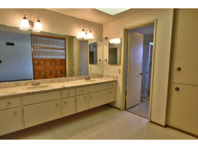 22675 Coleta Drive Salinas, CA 93908 - Photo 18 of 23 a bathroom with a double vanity sink and a mirror